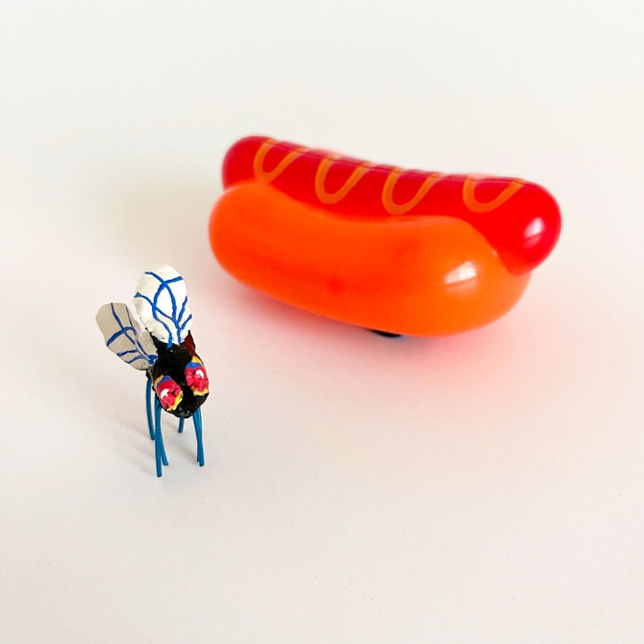 Paper Mache Housefly with hotdog for scale