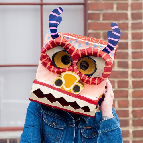 Katrina in a custom dragon mask